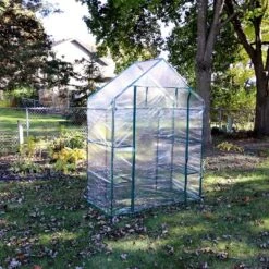 Sunnydaze Decor Sunnydaze Outdoor Portable Tiered Growing Rack Deluxe Walk-In Greenhouse With Roll-Up Door - 4 Shelves - Clear - 54" X 28" X 77" -Sunnydaze Decor GUEST 814f7270 00c1 4a5e ad3c b1005f24139f