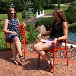 Sunnydaze Decor Sunnydaze Plastic All-Weather Commercial-Grade Astana Indoor/Outdoor Patio Dining Arm Chair, Orange, 2pk -Sunnydaze Decor GUEST e4595050 330a 4c83 838d b37eec5f69ed